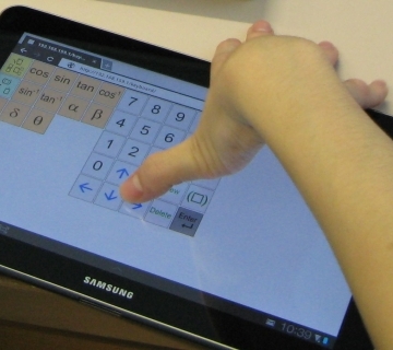 Facilitating mathematics learning for students with upper extremity disabilities using touch-input system